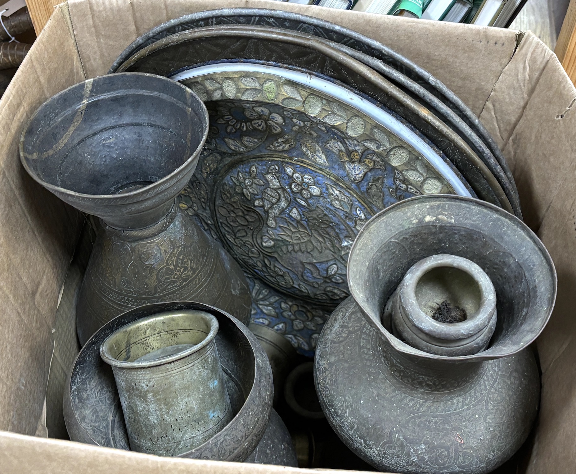 A collection of Indian metalware, including pots and measures, five trays, two vases, etc. tallest 40cm